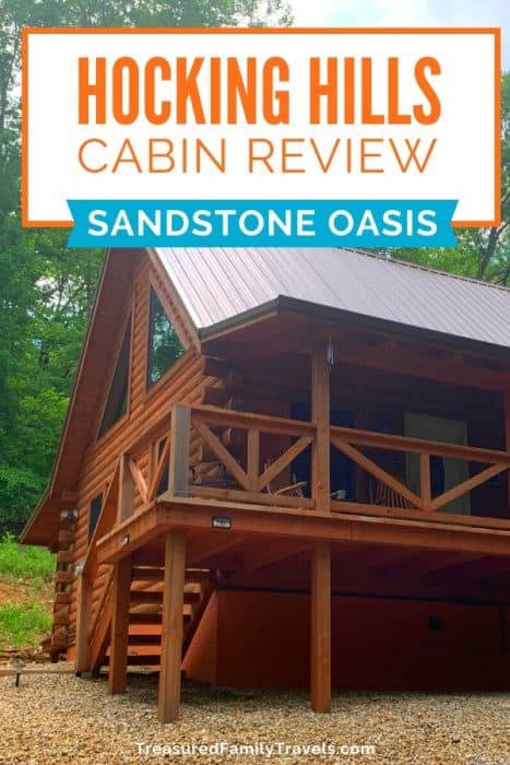 Log cabin set in the trees with the title Hocking Hills Cabin Review - Sandstone Oasis